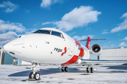 Ambulance jet Challenger 650 mood shot with blue sky